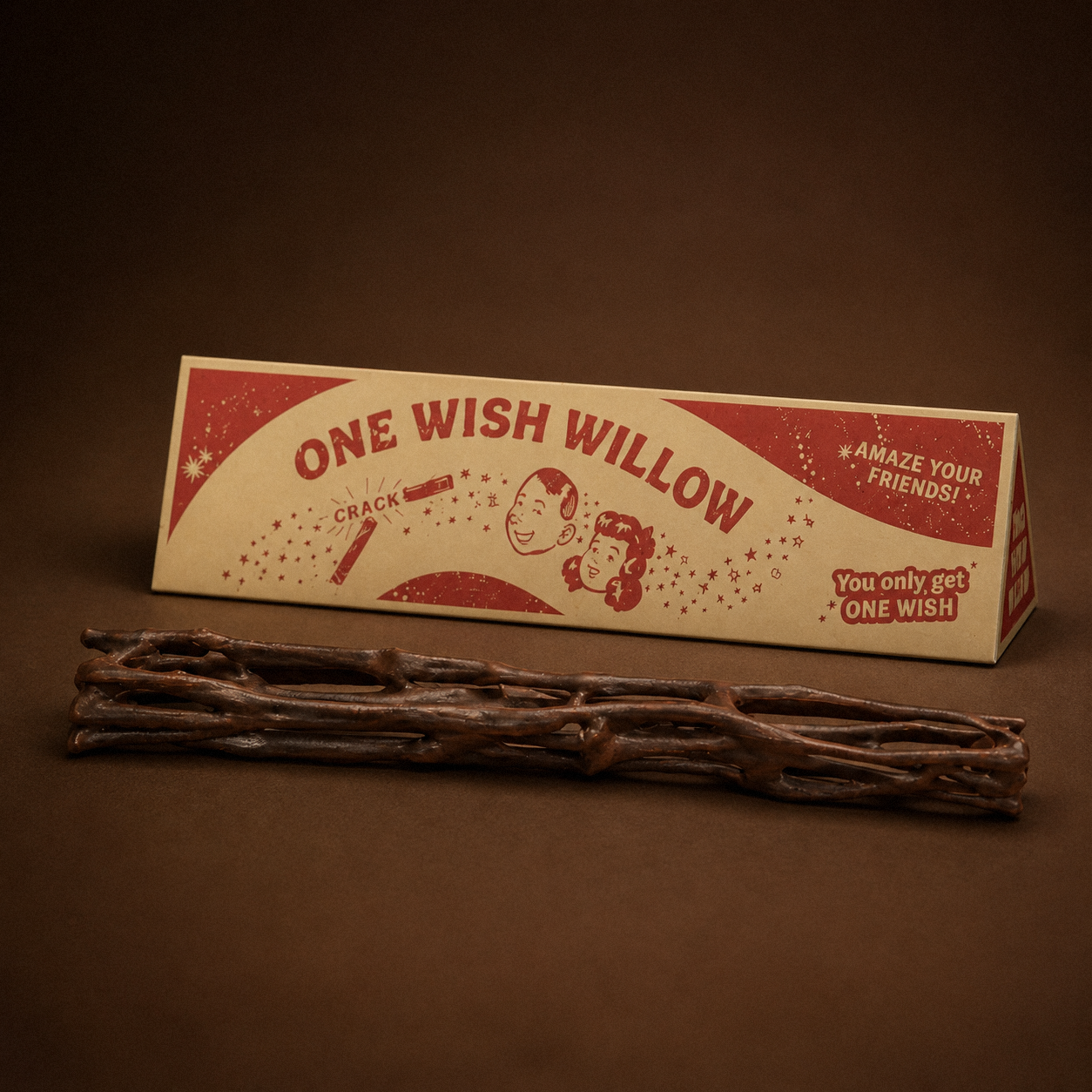 A retro-styled box labeled 'one wish willow' with an odd stick in front of it
