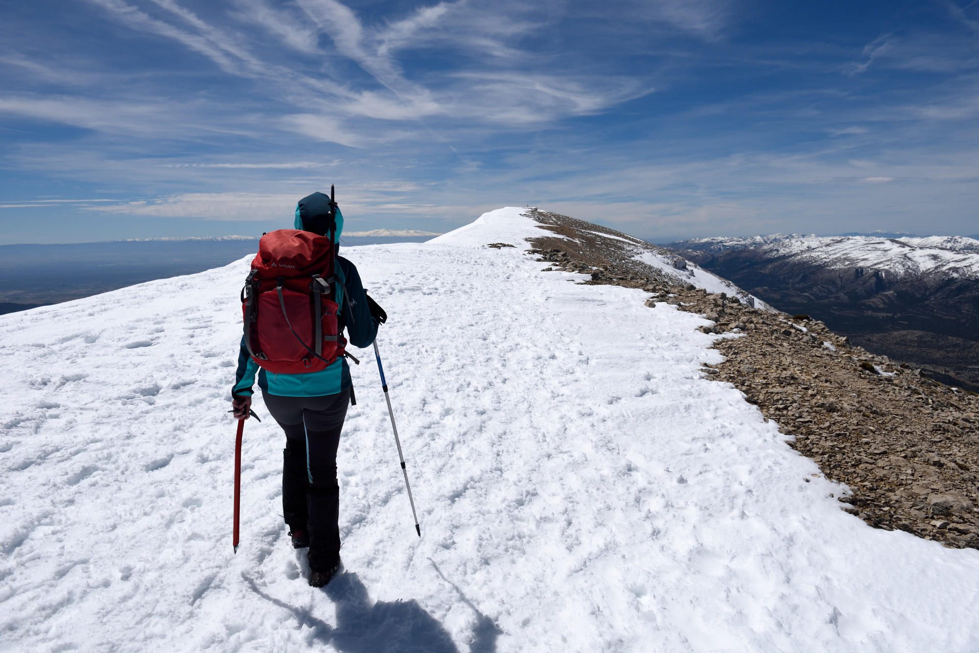 Photo of a hiker about to reach a summit